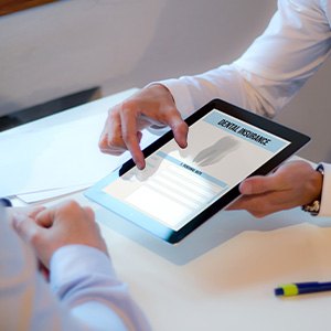 a patient reviewing a dental insurance form