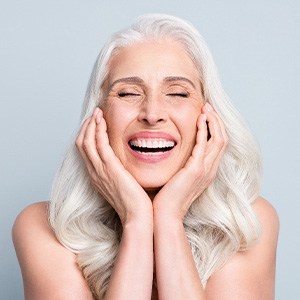 a dental implant patient smiling 